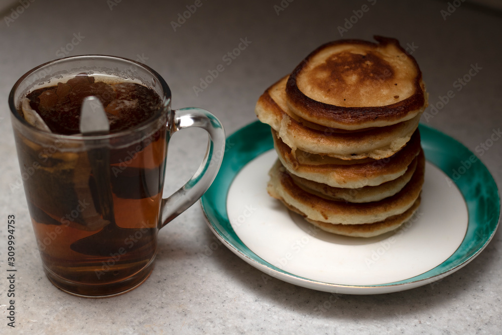 cup of coffee and cookies on table