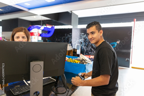 Young man walking in the store photo