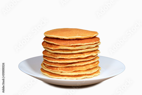 Stack of plain pancakes on a white plate isolated on white background
