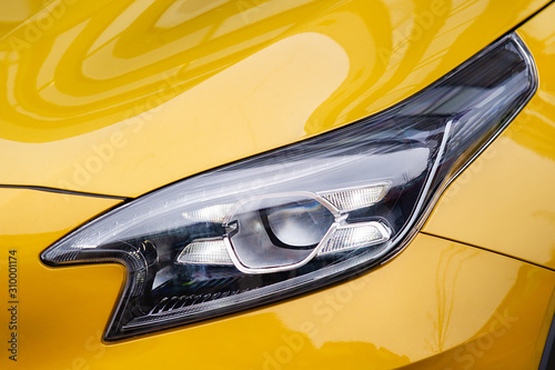 Front light of yellow car
