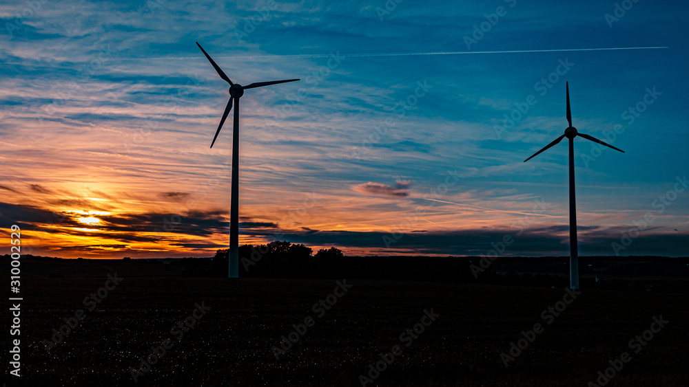 Obraz premium Beautiful sunset with wind power plant silhouette near Kugl, Bavaria, Germany