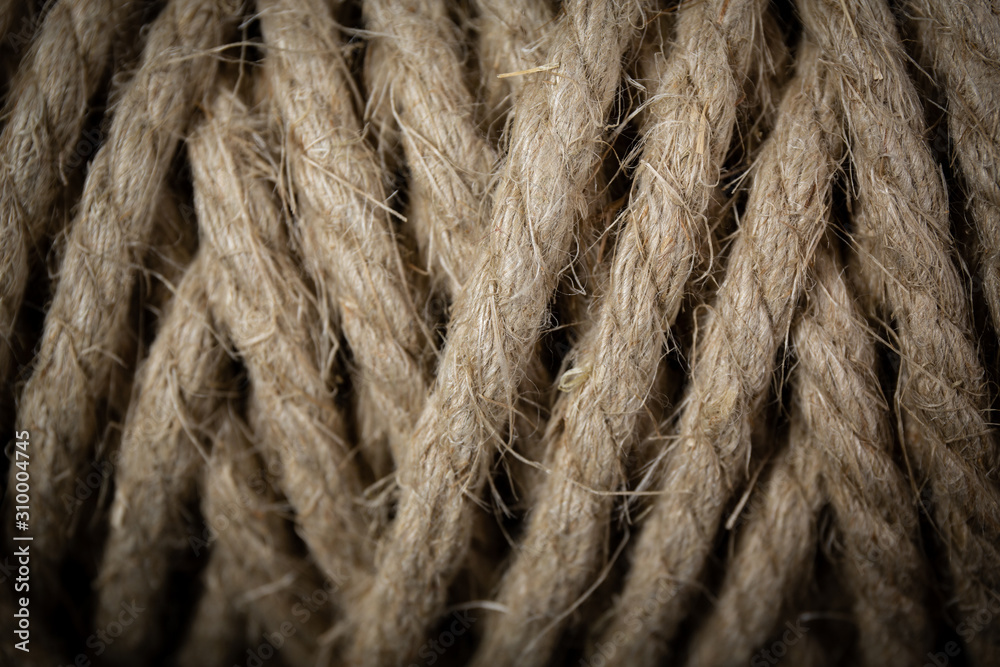 macro shot of a spool of organic hemp rope on black background
