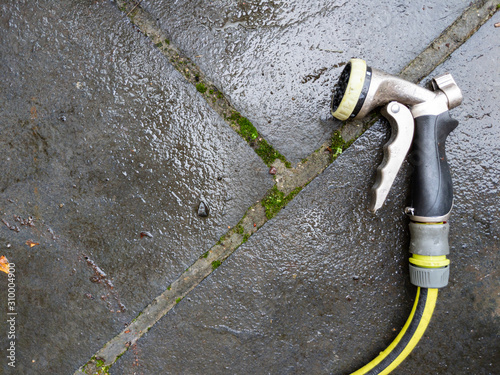 high angle view of hose nozzle on patio