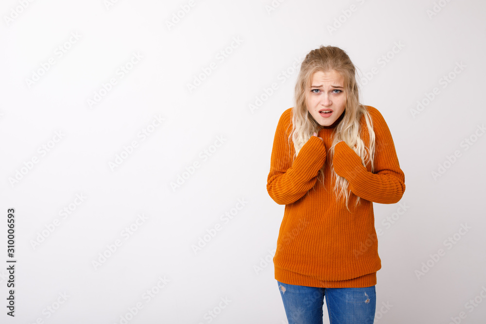 A young girl shows herself with her hands. Emotion of perplexity A young girl shows herself with her hands. Emotion of perplexity