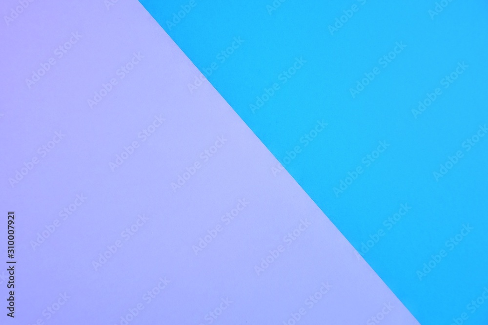 Two tone paper background with violet and blue color. Blank colorful backdrop with empty space for image or text. Mockup concept. Neon empty paper background. Clean purple and blue wallpaper Two tone paper background with violet and blue color. Blank colorful backdrop with empty space for image or text. Mockup concept. Neon empty paper background. Clean purple and blue wallpaper