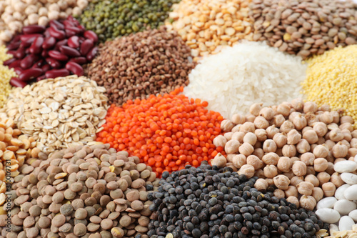 Different types of legumes and cereals as background, closeup. Organic grains