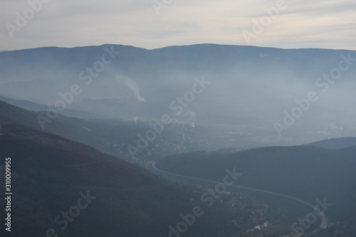 Air polluting the river valley. Aerial view of polluting air in Nis, Serbia