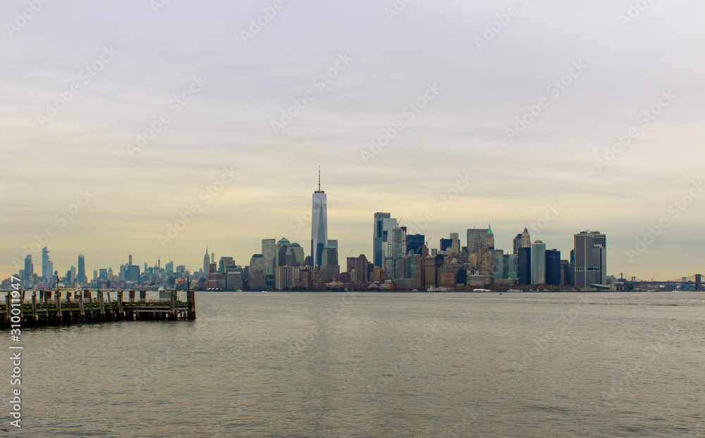 Manhatten, New York City skyline with Hudson river and grey skies