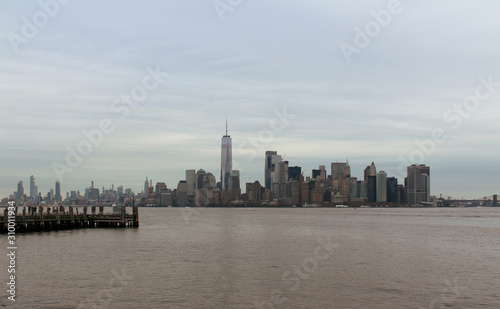 Manhatten  New York City skyline with Hudson river and grey skies