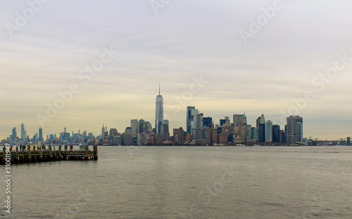 Manhatten, New York City skyline with Hudson river and grey skies