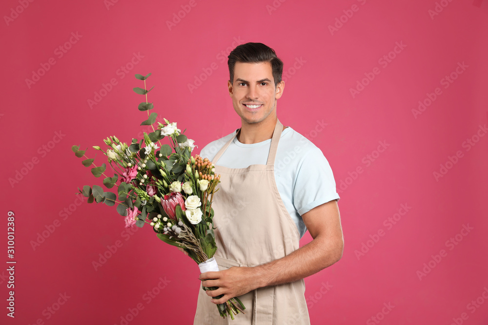Florist with beautiful bouquet on pink background Florist with beautiful bouquet on pink background