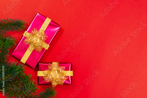 Christmas background concept. Top view of Christmas gift box gold balls with spruce branches © Jirawatfoto