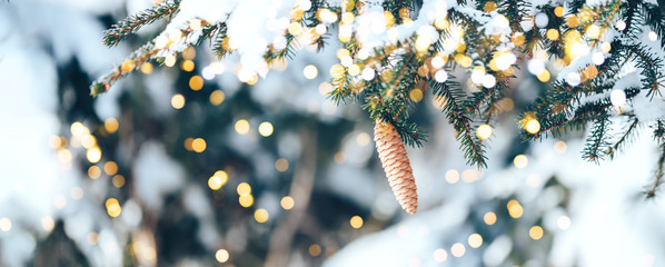 Christmas tree outdoor with snow, lights bokeh around, and snow falling, Christmas atmosphere. Happy New Year