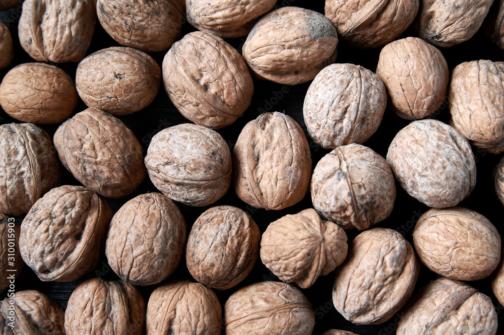 walnut on a black wooden background still life, walnut walnut on a black wooden background still life, walnut