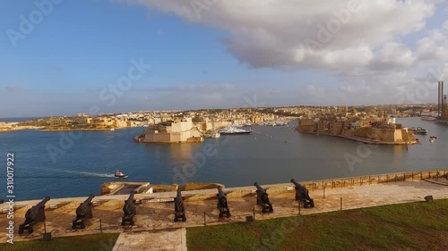 War museum and Grand harbor with Three fortified cities, Birgu, Senglea and Cospicua panoramic view from the Upper Barrakka Gardens, Valletta, Malta photo