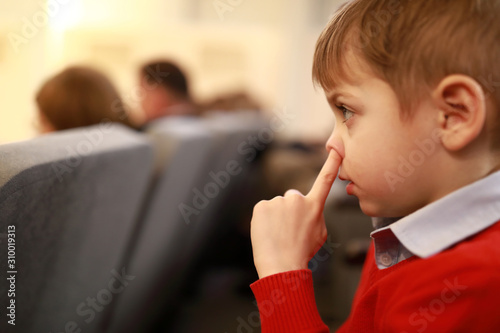 Child picks his nose
