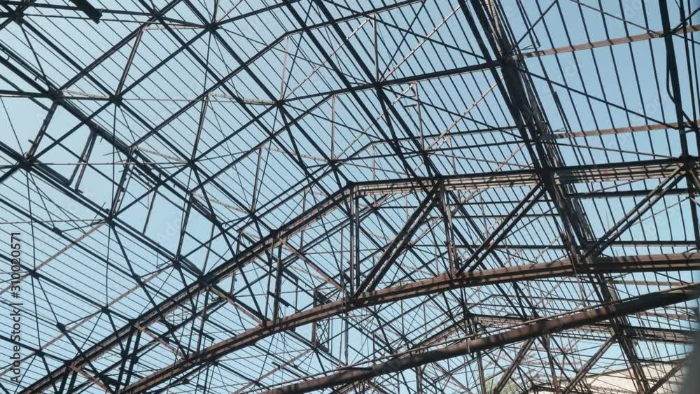 Metal constructions of roof of old abandoned ruined building of metallurgic plant. Metal constructions of roof of old abandoned ruined building of metallurgic plant.