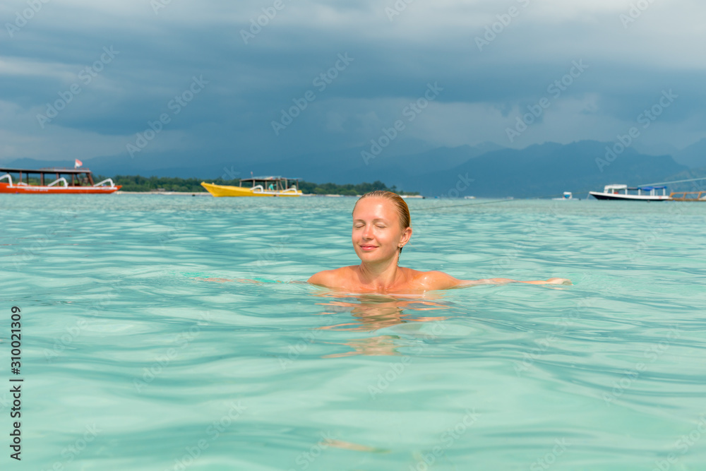 Woman at tropical island beach