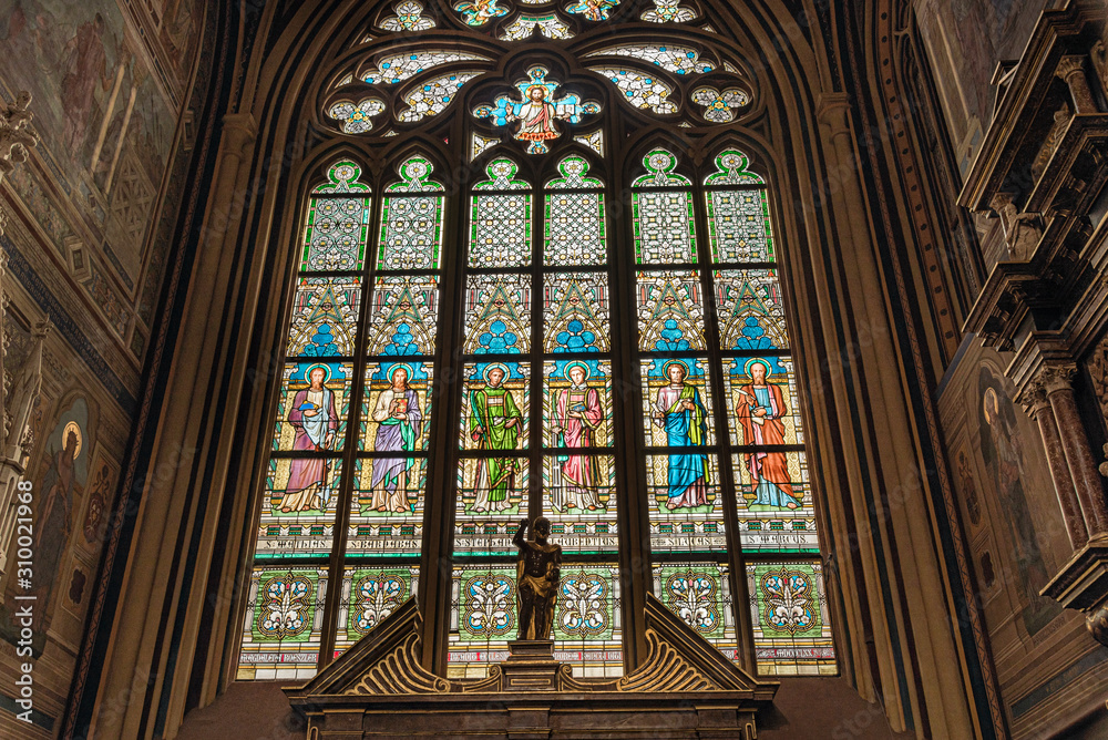 Fototapeta premium Stained glass inside St. Vitus's Cathedral in Prague Castle, Czech Republic. Gothic ornamental details of St. Vitus Cathedral 