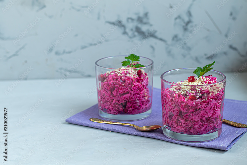 Holiday salad of beets and soft cheese in glasses. Added sesame seeds and chanok. Holiday salad of beets and soft cheese in glasses. Added sesame seeds and chanok.
