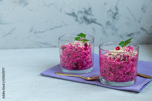 Holiday salad of beets and soft cheese in glasses. Added sesame seeds and chanok.