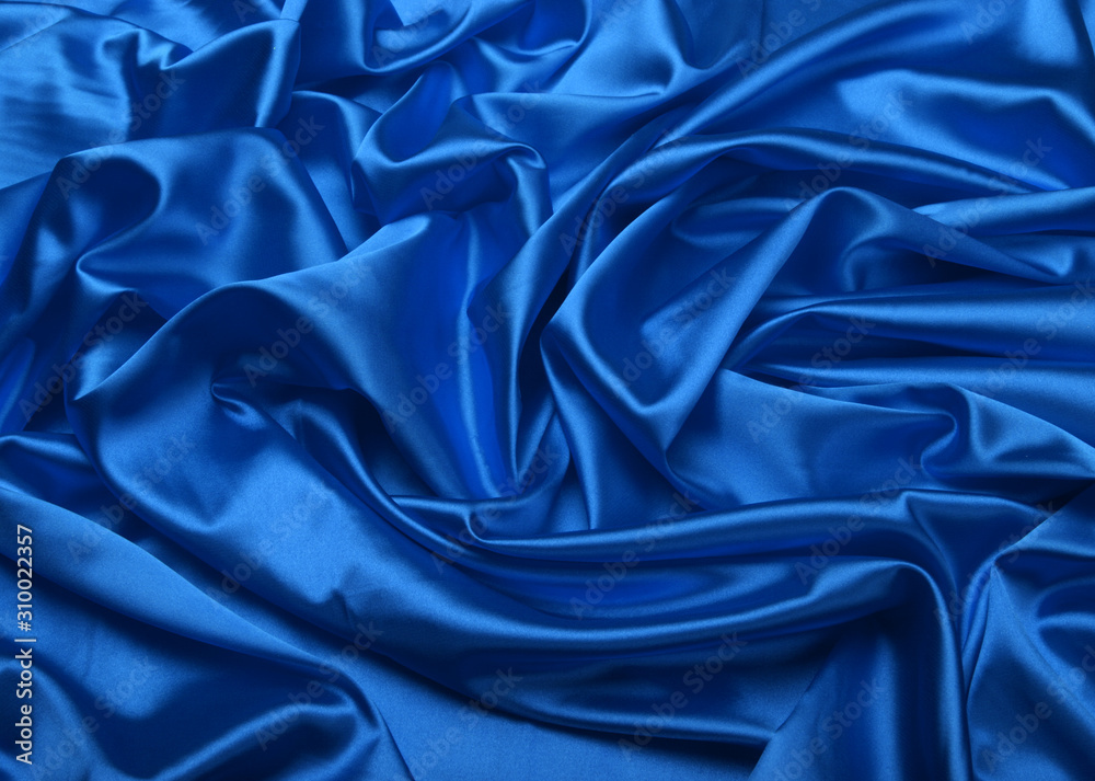 Blue color silk fabric. Abstract background. Blue color silk fabric. Abstract background.