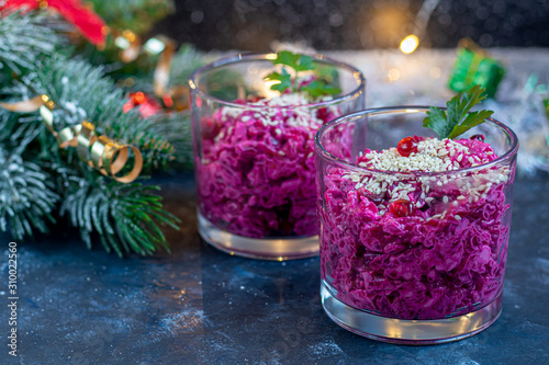 Holiday salad of beets and soft cheese in glasses. Added sesame seeds and chanok.