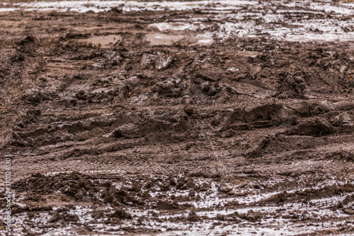dirty mud road background at winter with selective focus and blur  photo