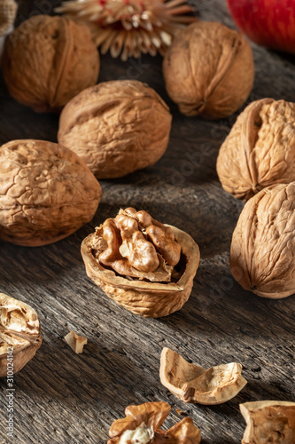 Whole and broken walnuts on a table