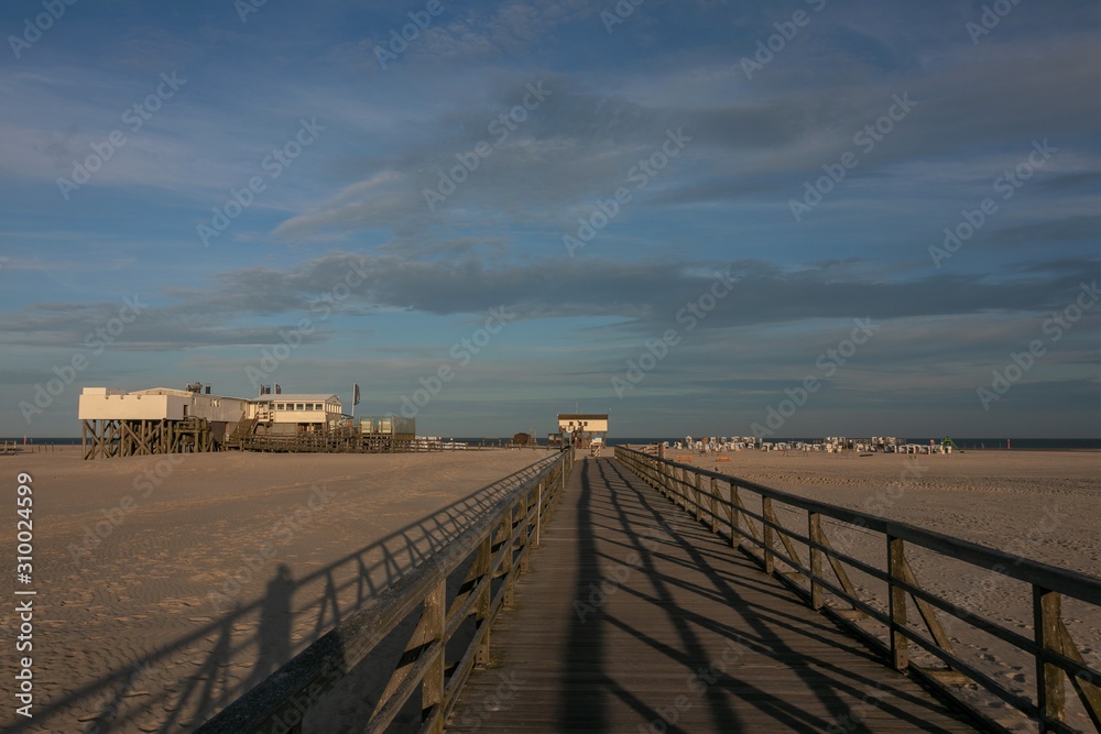 footbridge to the famous stilt houses at the popular vacation resort of Sankt Peter Ording 