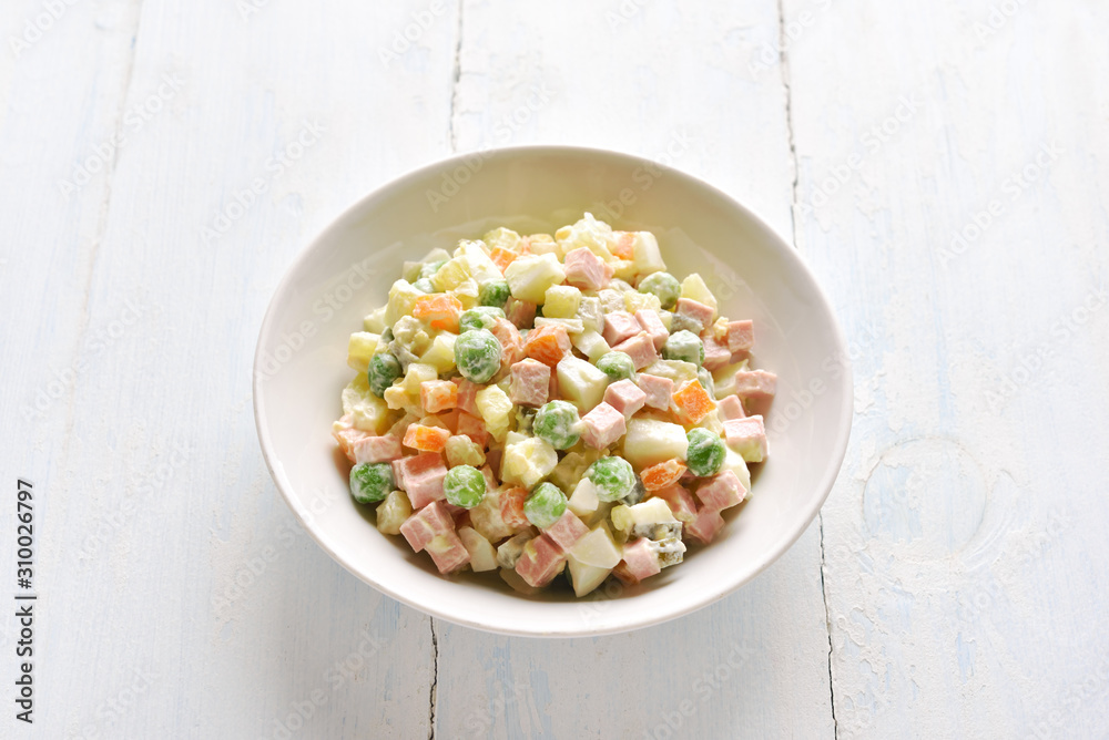 Olivier salad in bowl Olivier salad in bowl