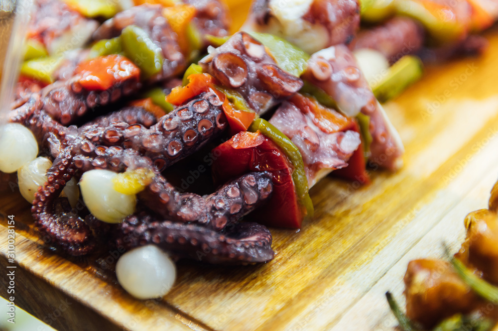 A wide variety of traditional tapas with seafood in Spain at the San Miguel market A wide variety of traditional tapas with seafood in Spain at the San Miguel market