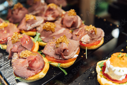 A wide variety of traditional tapas with seafood in Spain at the San Miguel market