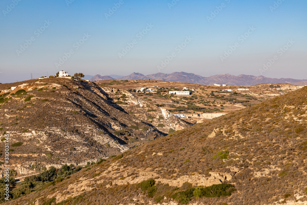 Small mountains, valley and typical  vegetation in Milos