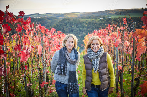 Portrait of two mature woman in a vineyard photo