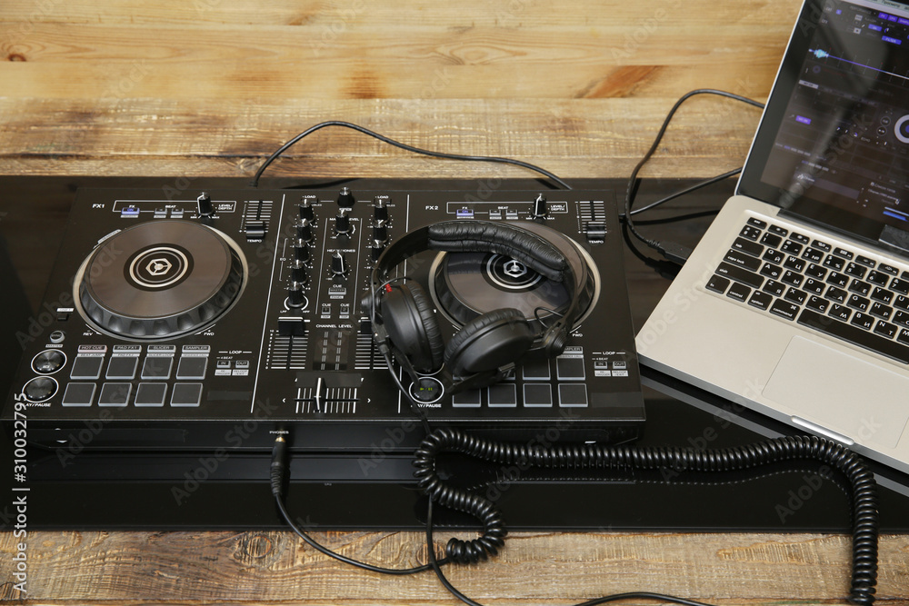 DJ equipment controller and headphones and laptop. Music background,  banner, card. Modern technologies Stock Photo | Adobe Stock
