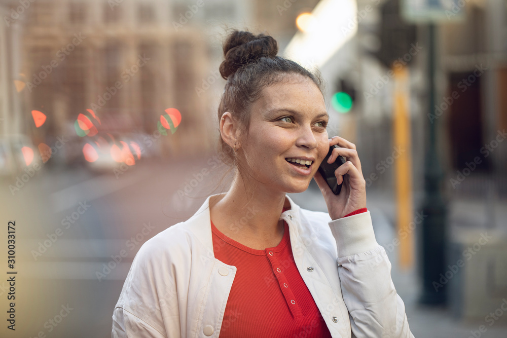 Young woman on the phone in the city Young woman on the phone in the city