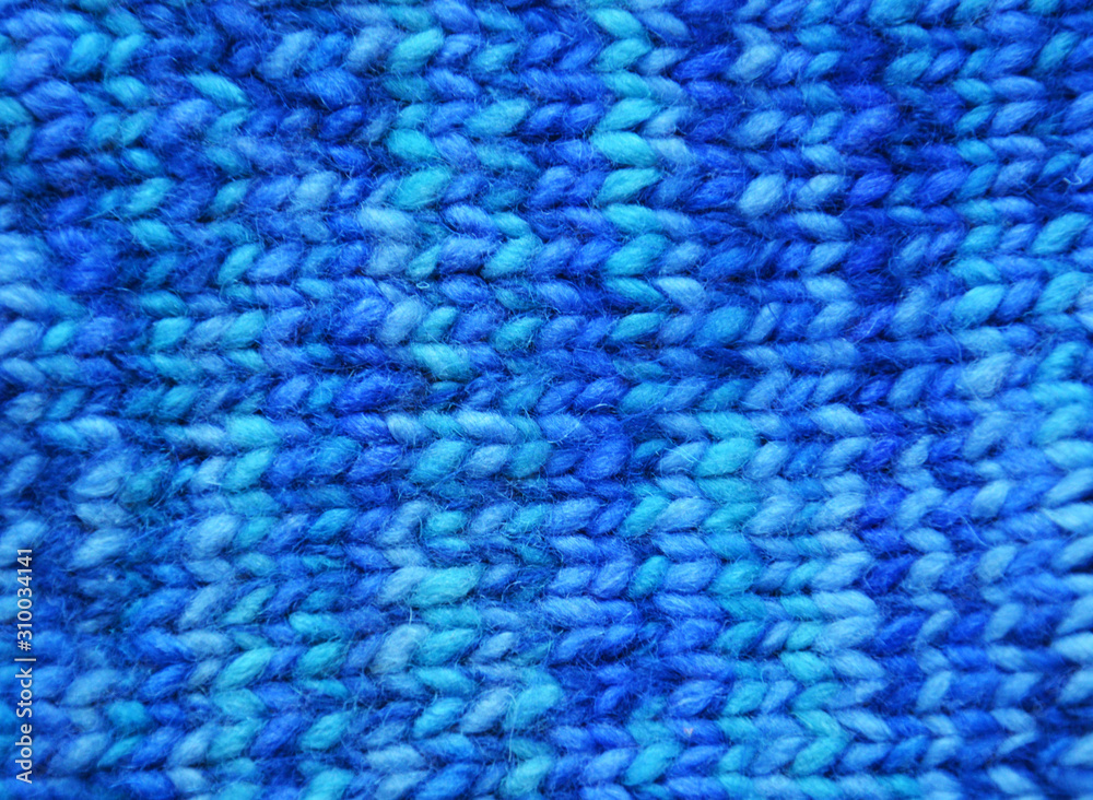Cozy Christmas background for design use. Knitted blue woolen background. Cozy Christmas background for design use. Knitted blue woolen background.