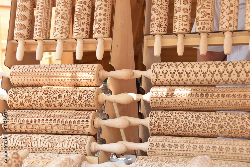 Fototapeta premium decorative patterns carved on wooden rollers to roll the dough,wooden rolling pins for Christmas cookies