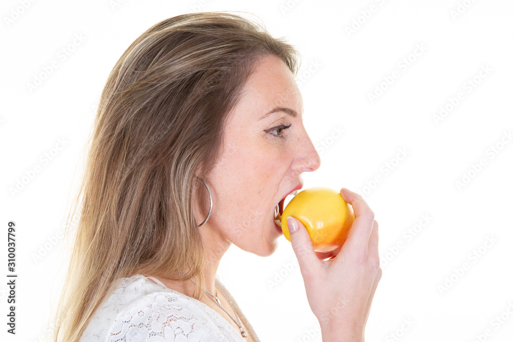young woman blond with red yellow apple profile young woman blond with red yellow apple profile