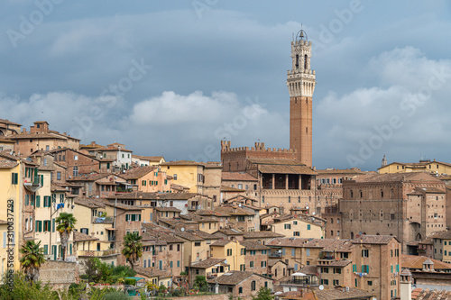 Medieval town Siena skyline view with historic buildings and Town Hall Bell Tower in Italy
