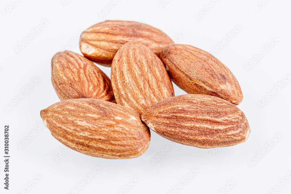 macro almond nuts on a white background macro almond nuts on a white background