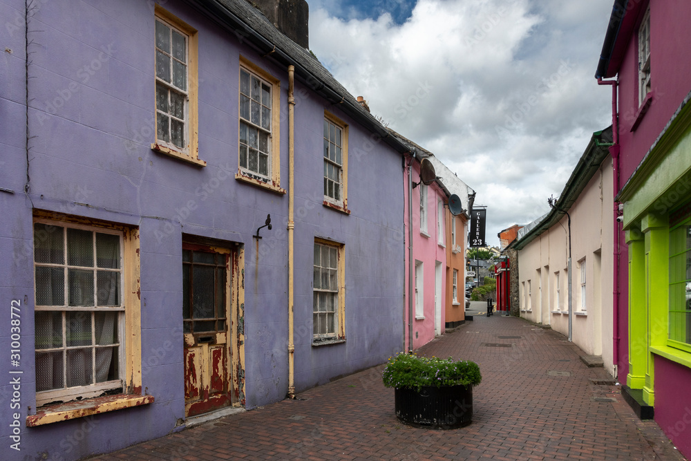 Residential buildings and stores amidst narrow lane of old town, Kinsale, County Cork, Ireland