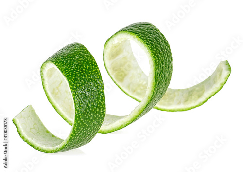Peel of lime fruit isolated on a white background. Citrus twist.