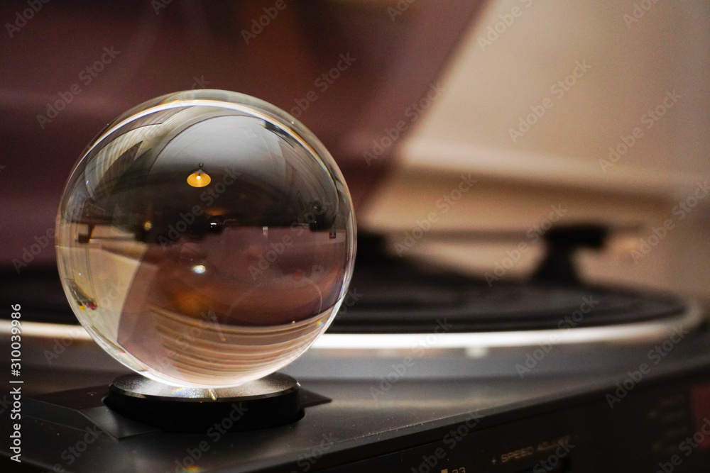 Glass sphere with reverse reflection in hand Glass sphere with reverse reflection in hand