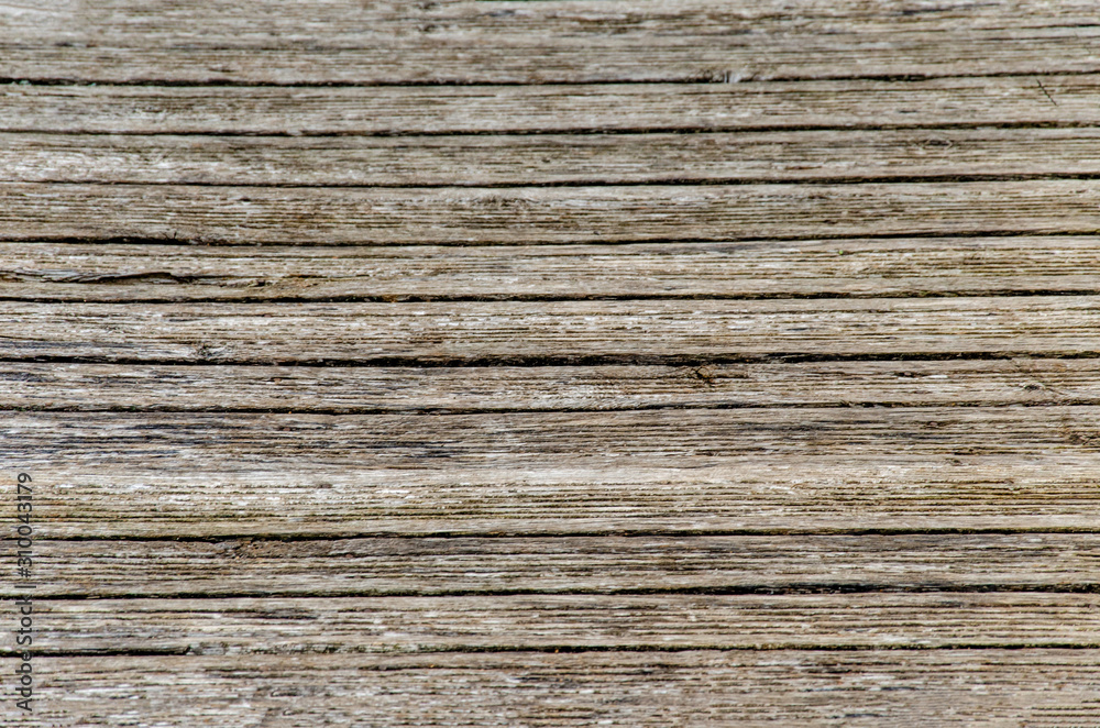 gray wooden background. Old dry boards. Wood texture. bridge or pier in the village near the river. gray wooden background. Old dry boards. Wood texture. bridge or pier in the village near the river.