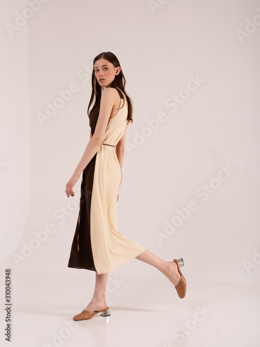 Fashionable photo. Girl model in fashionable clothes, studio shooting.