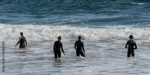 Family standing in the Atlantic Ocean, Ballyferriter, County Kerry, Ireland