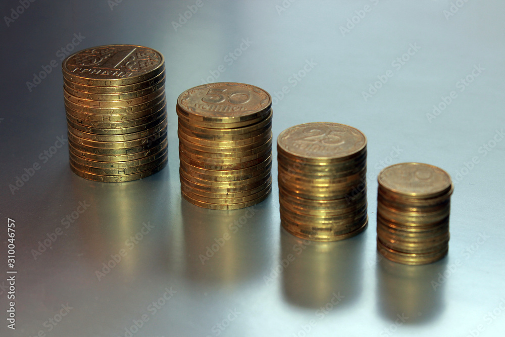 Stack of coins on gray background Stack of coins on gray background