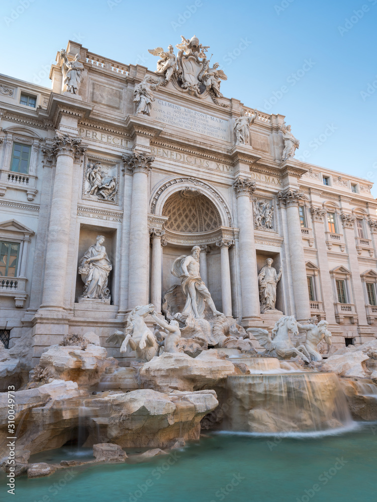 portrait view to sculptures in fountain Trevi in Rome in Italy